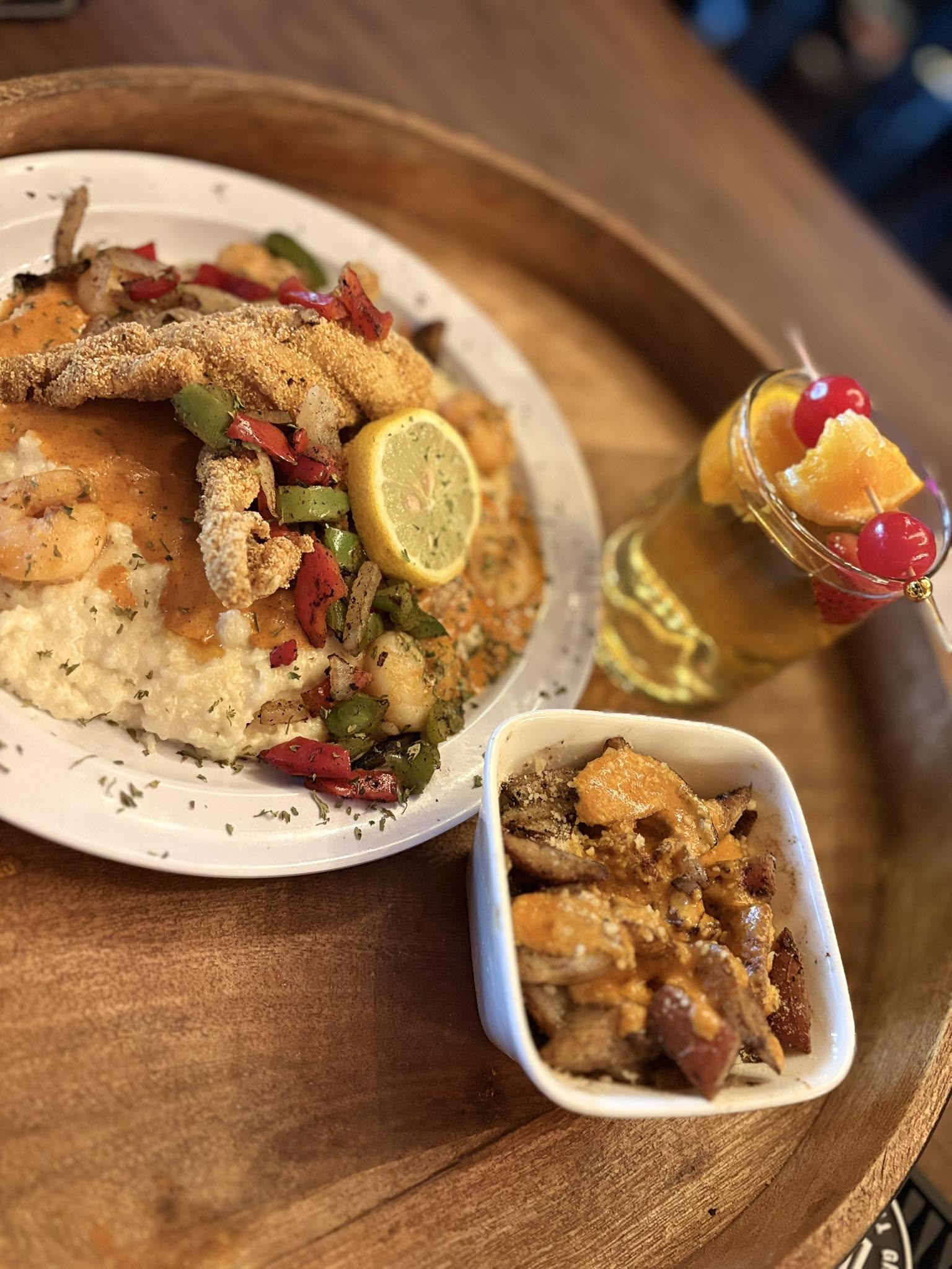 Fish, Shrimp & Grits with a side of potatoes