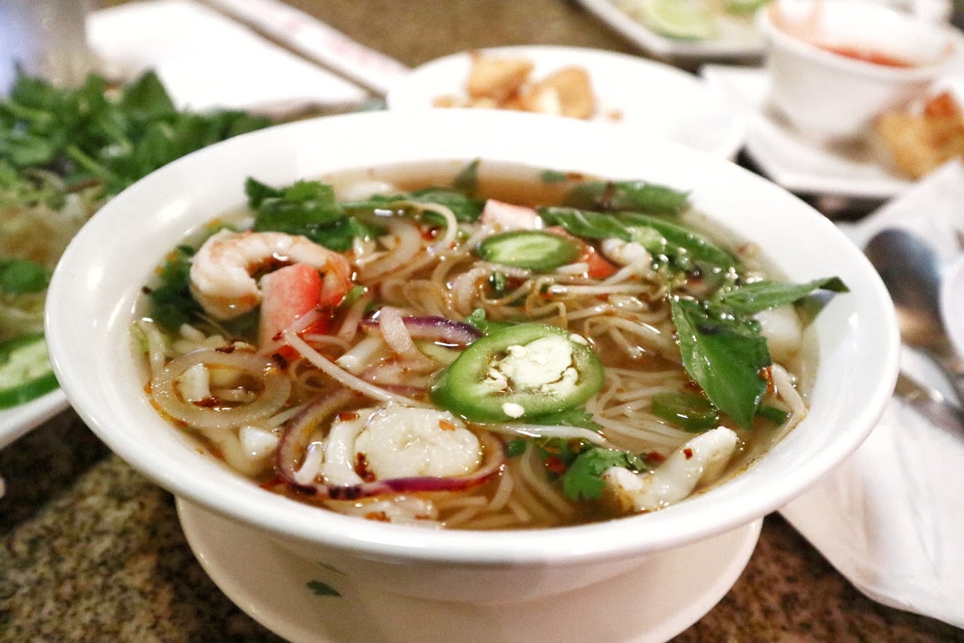 up close on a bowl of pho with visible shrimp and noodles in broth