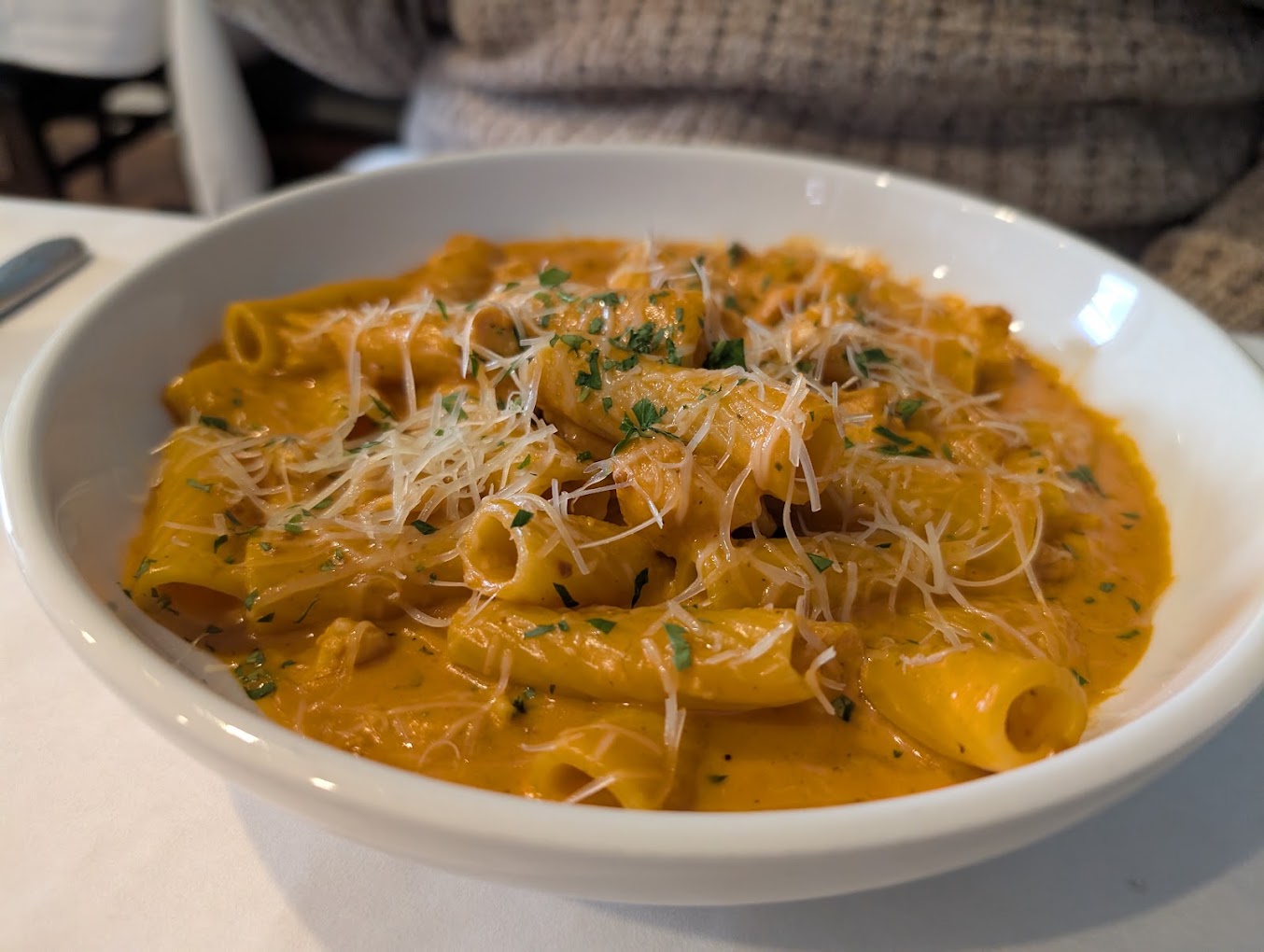 basked ziti in an orange colored vodka sauce bubbly hot