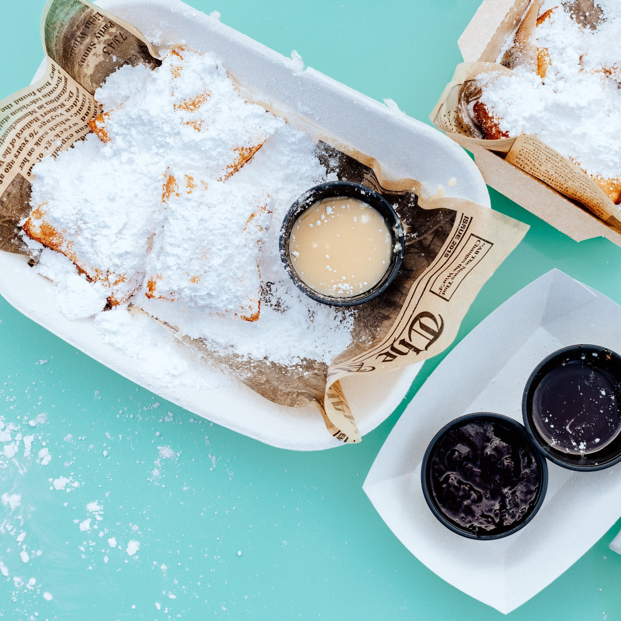 powdered sugar drowned beignets