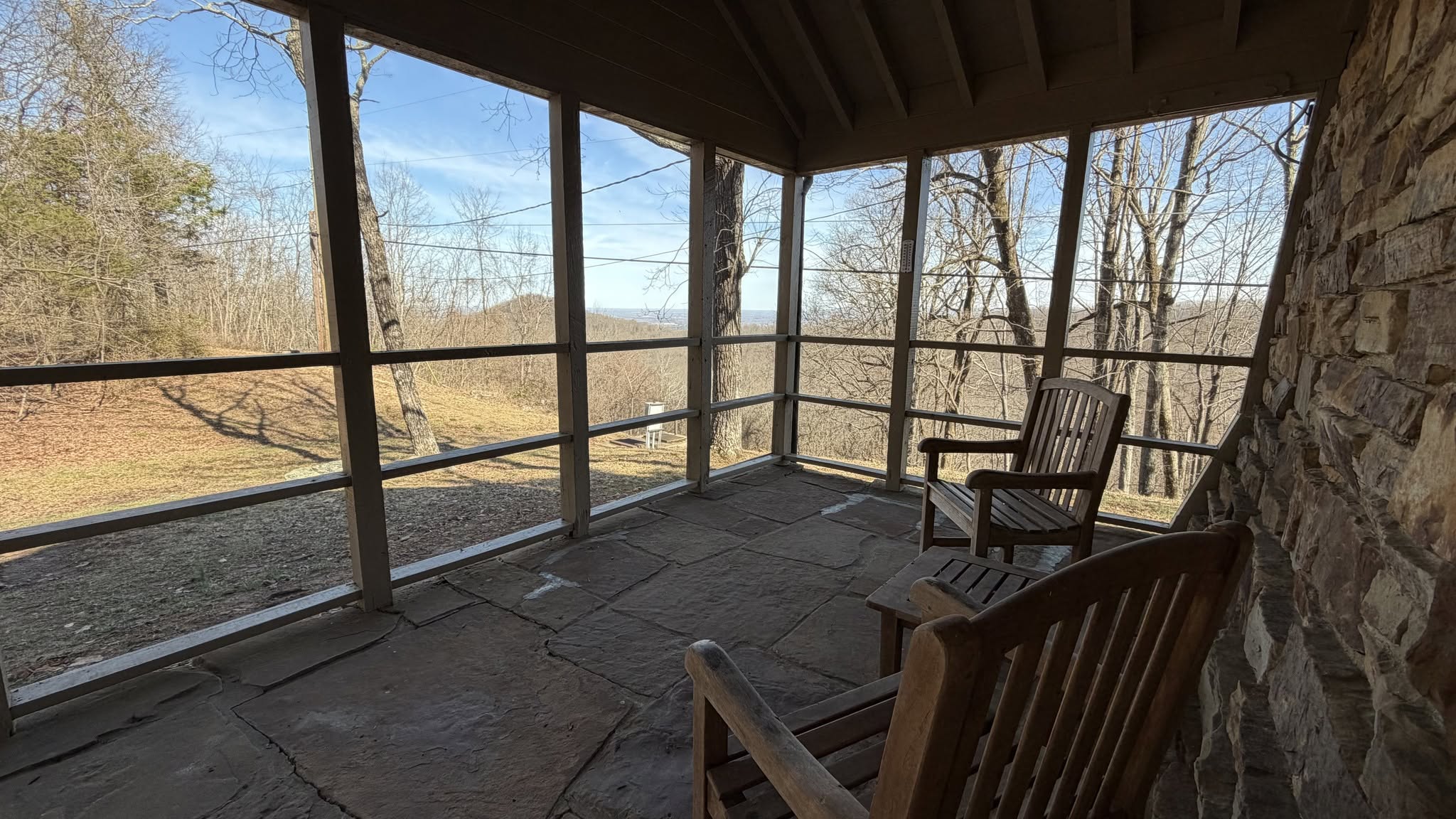 screened in cabin porch with chairs