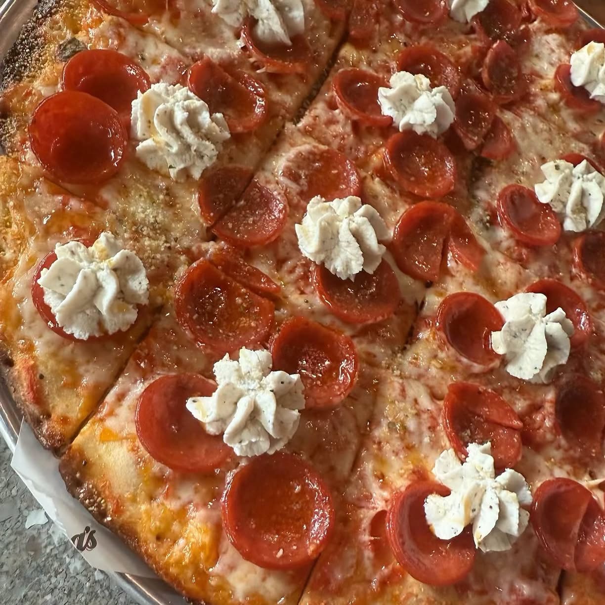 tavern style crust, made popular in Chicago, available at Valentina's