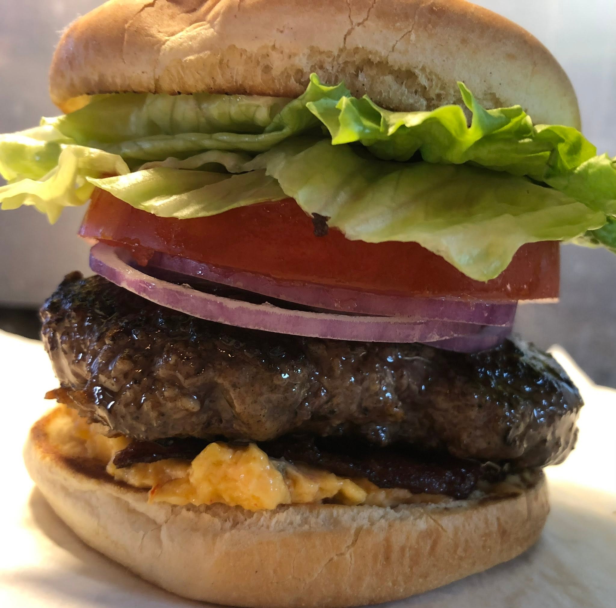 close up shot of a cheeseburger